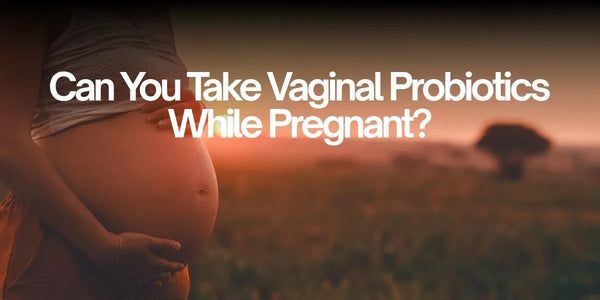 pregnant woman in the field holding her belly