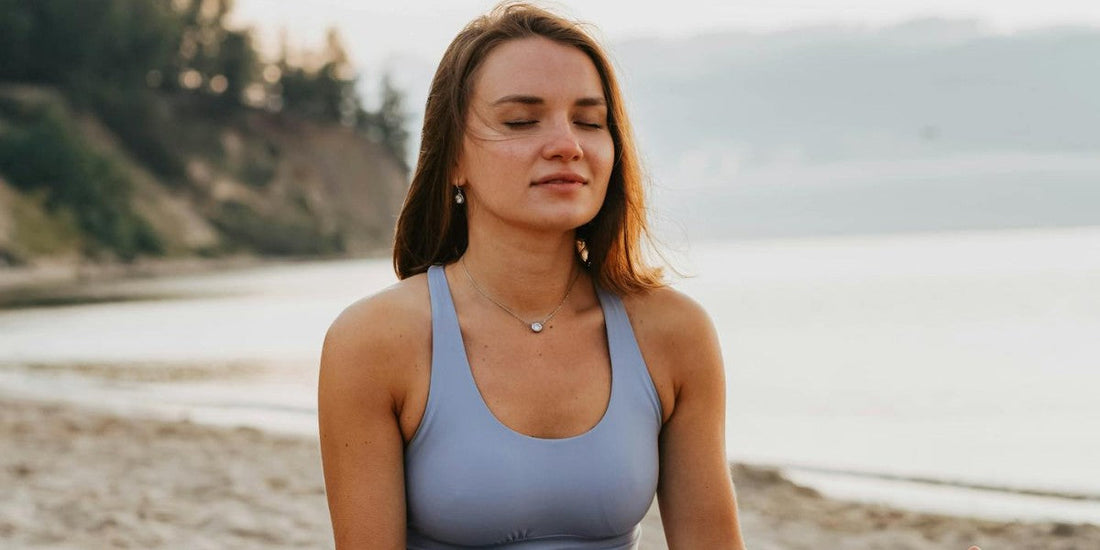 woman sitting calmly on the beach