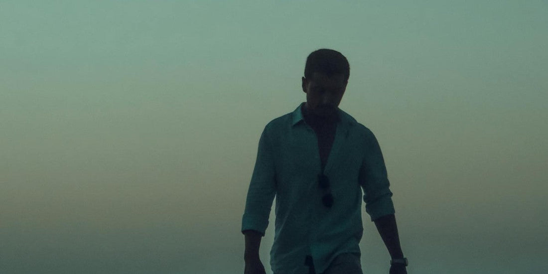 man walking with head down