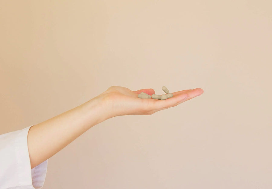 Image of a hand holding pills